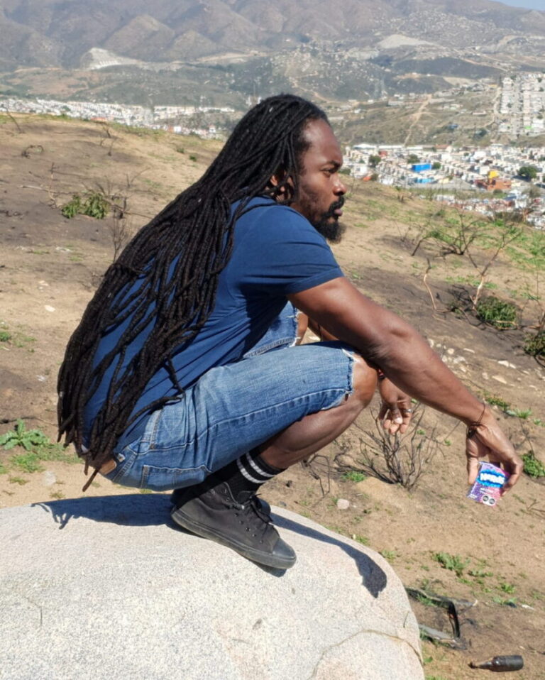 A father sits alone on a city rooftop at dusk, gazing into the distance, capturing the emotional weight of fatherhood and isolation.