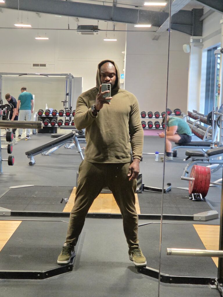Not The Default Parent Anymore as a parent takes a gym mirror selfie during personal workout time