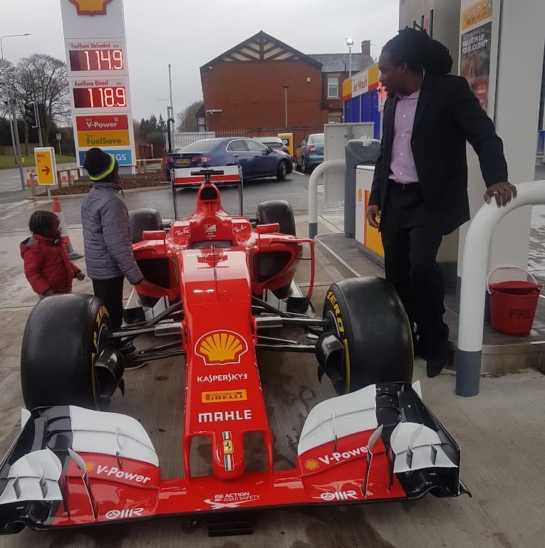 Photos of me introducing my boys toa formula 1 car