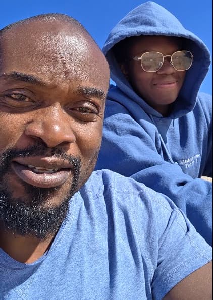 Father and son spending time together, representing connection and communication in long-distance parenting.